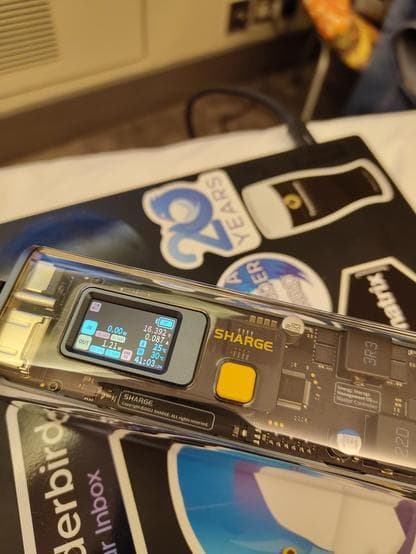 Power bank on a laptop plugged into the back most port, showing a little over 1W of output power (at 20V)